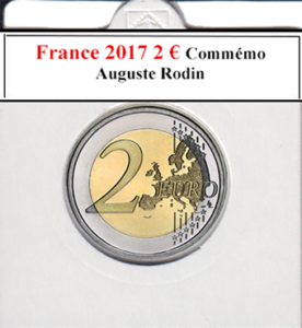Lors d'une brocante, j'ai découvert une collection d'euros fascinante comprenant la pièce française de 2 euros de 2017, commémorant Auguste Rodin avec un verso neuf et artistique. À côté, une caméra vintage capturait des moments précieux, une radio ancienne diffusait des histoires intemporelles, et un livre ancien sur l'art complétait cette trouvaille culturelle enrichissante.
