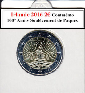 À la brocante, j'ai découvert une pièce irlandaise de 2 euros de 2016, commémorant le 100e anniversaire du soulèvement de Pâques en 1916, en parfait état. Son design historique captivait par sa symbolique patriotique. À côté, une caméra vintage capturait des moments précieux, une radio ancienne diffusait des récits historiques irlandais, tandis qu'un livre ancien sur l'histoire de l'Irlande enrichissait cette trouvaille culturelle et historique.